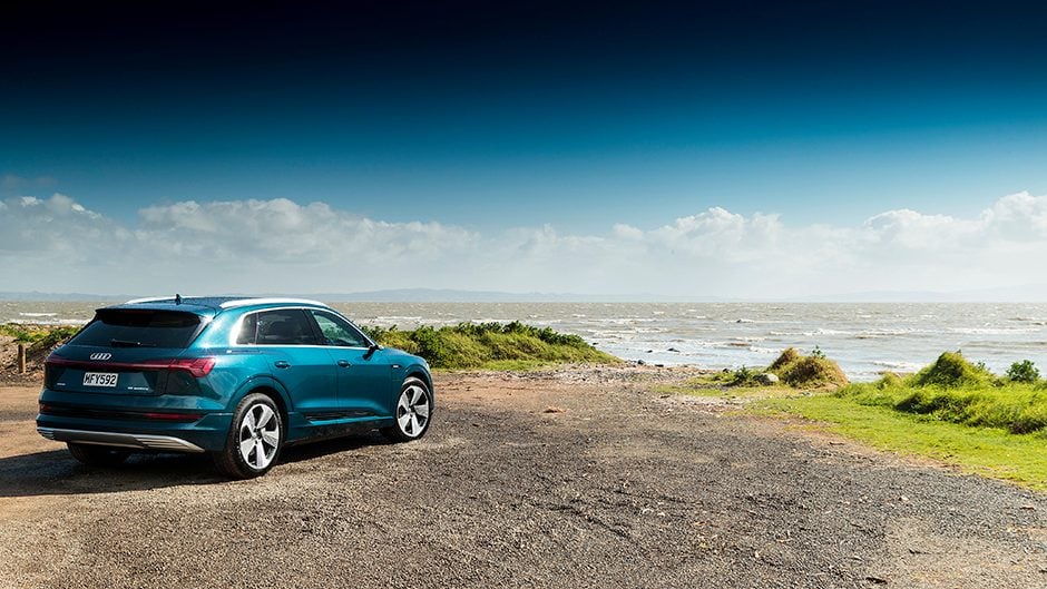 Audi e-tron 55 quattro rear static by water