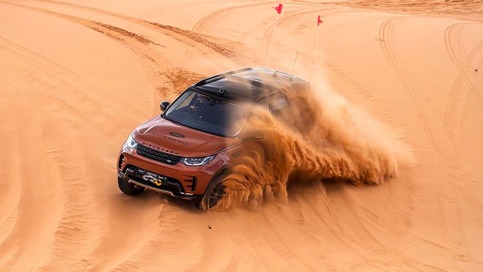 2017 Land Rover Discovery kicking up sand