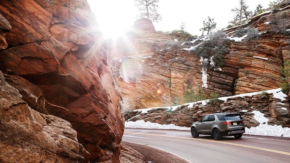 2017 Land Rover Discovery driving through canyon