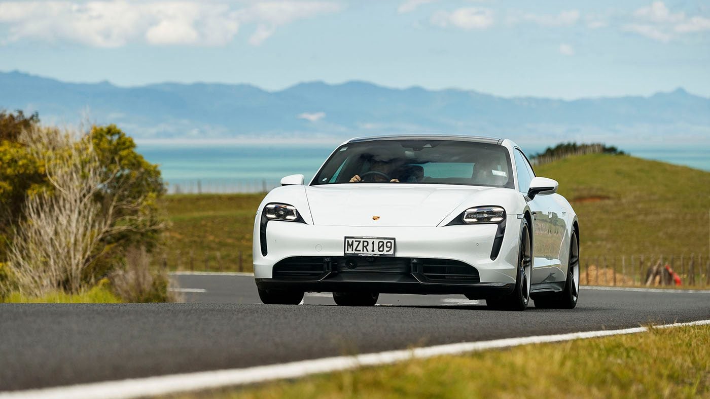 Porsche Taycan driving front view