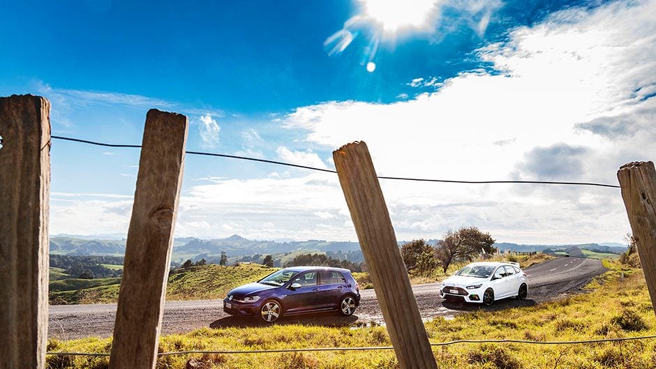 Ford Focus RS vs VW Golf R parked on roadside