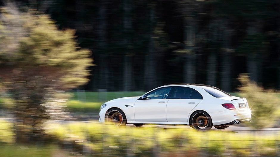 2017 Mercedes-AMG E 63 S 4MATIC+ driving past trees
