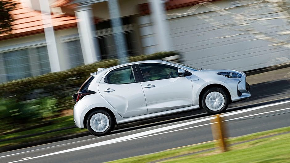 Toyota Yaris Hybrid driving through town
