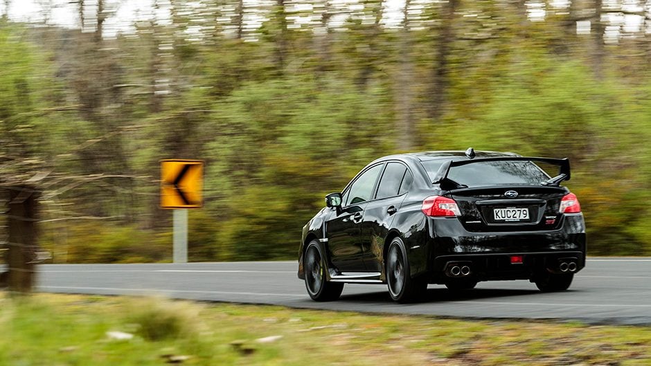 2017 Subaru WRX STI Premium driving past trees