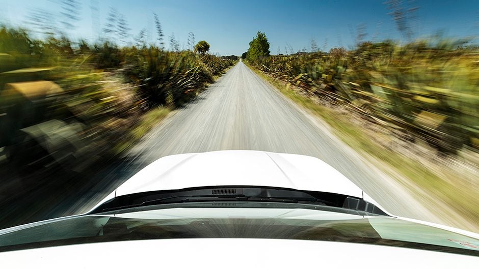 2018 Subaru Forester Premium driving fast on gravel road