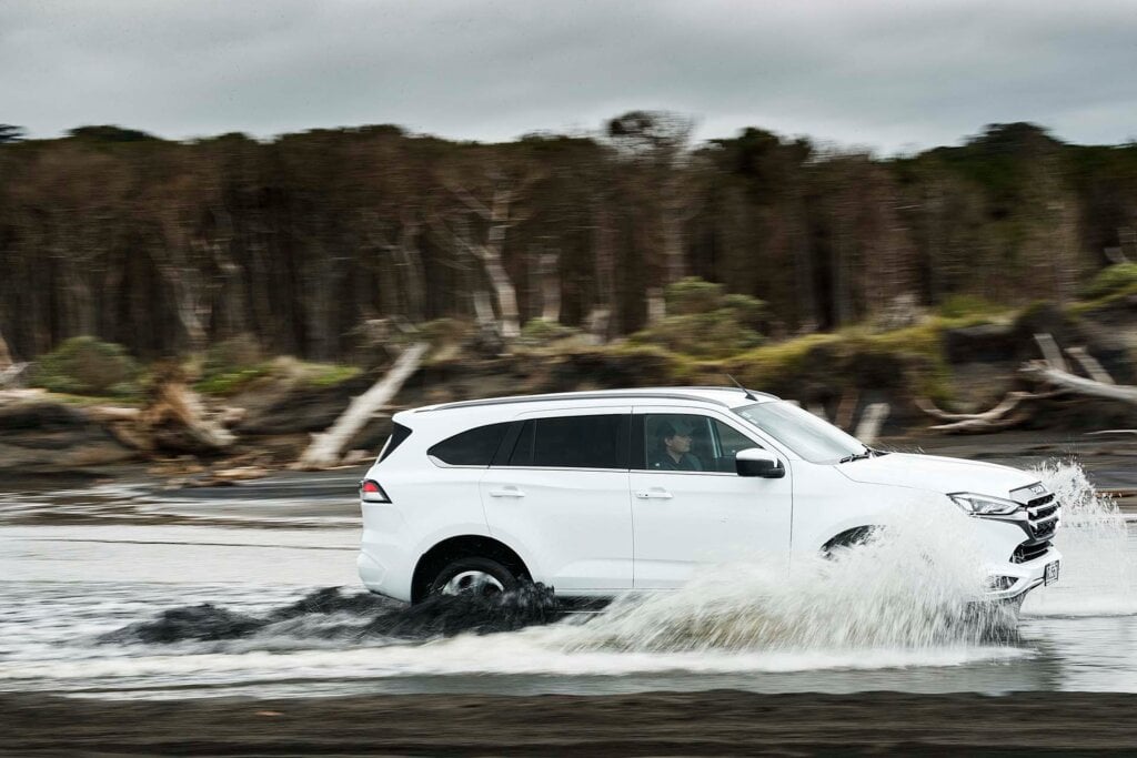 2022 Isuzu MU-X driving through river