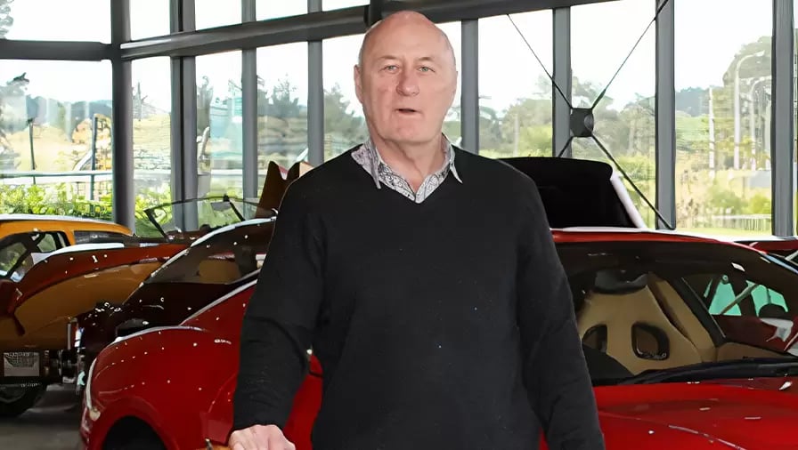 Allan Drinkrow standing in car collection