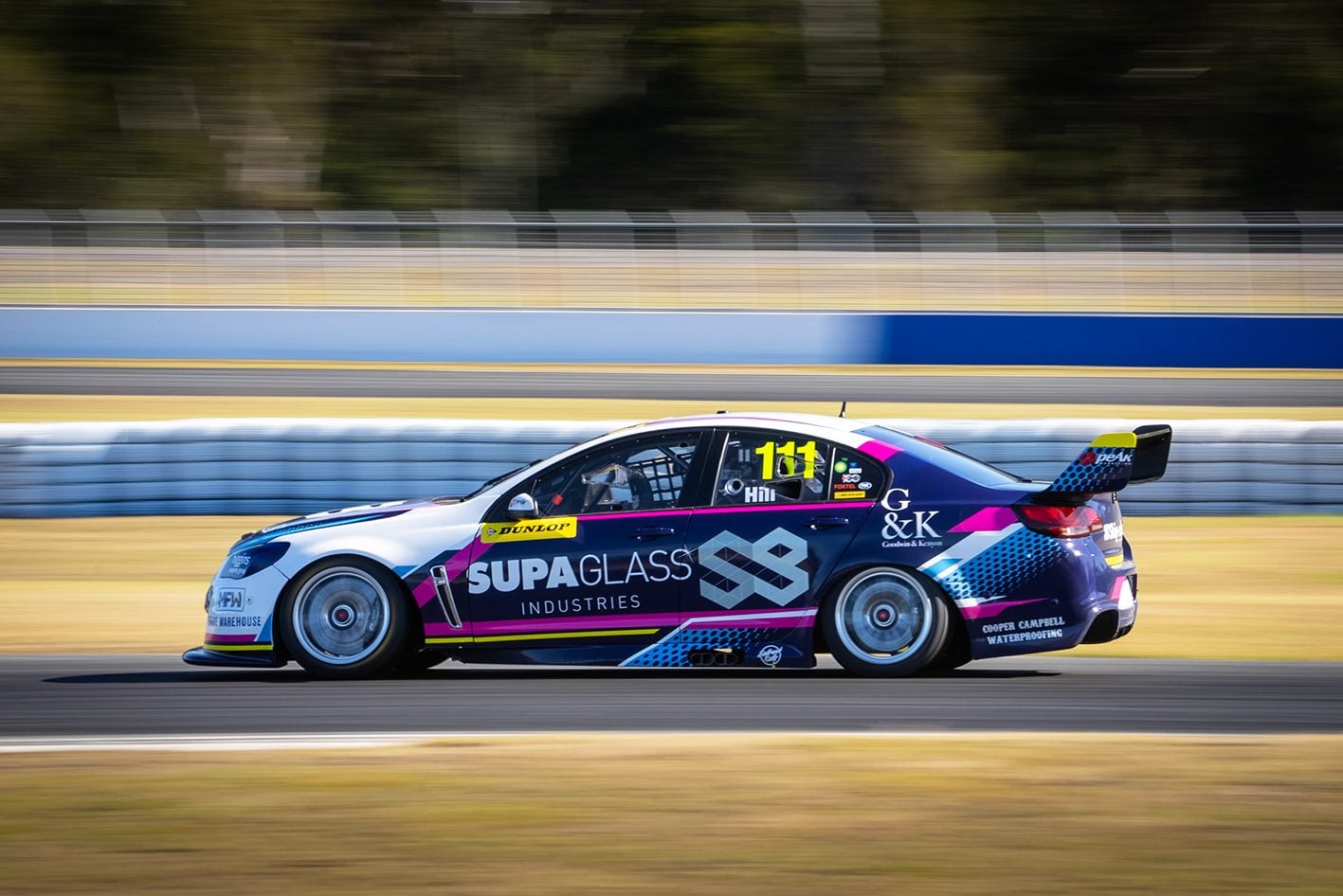 Holden Commodore V8 Supercar side racing on track