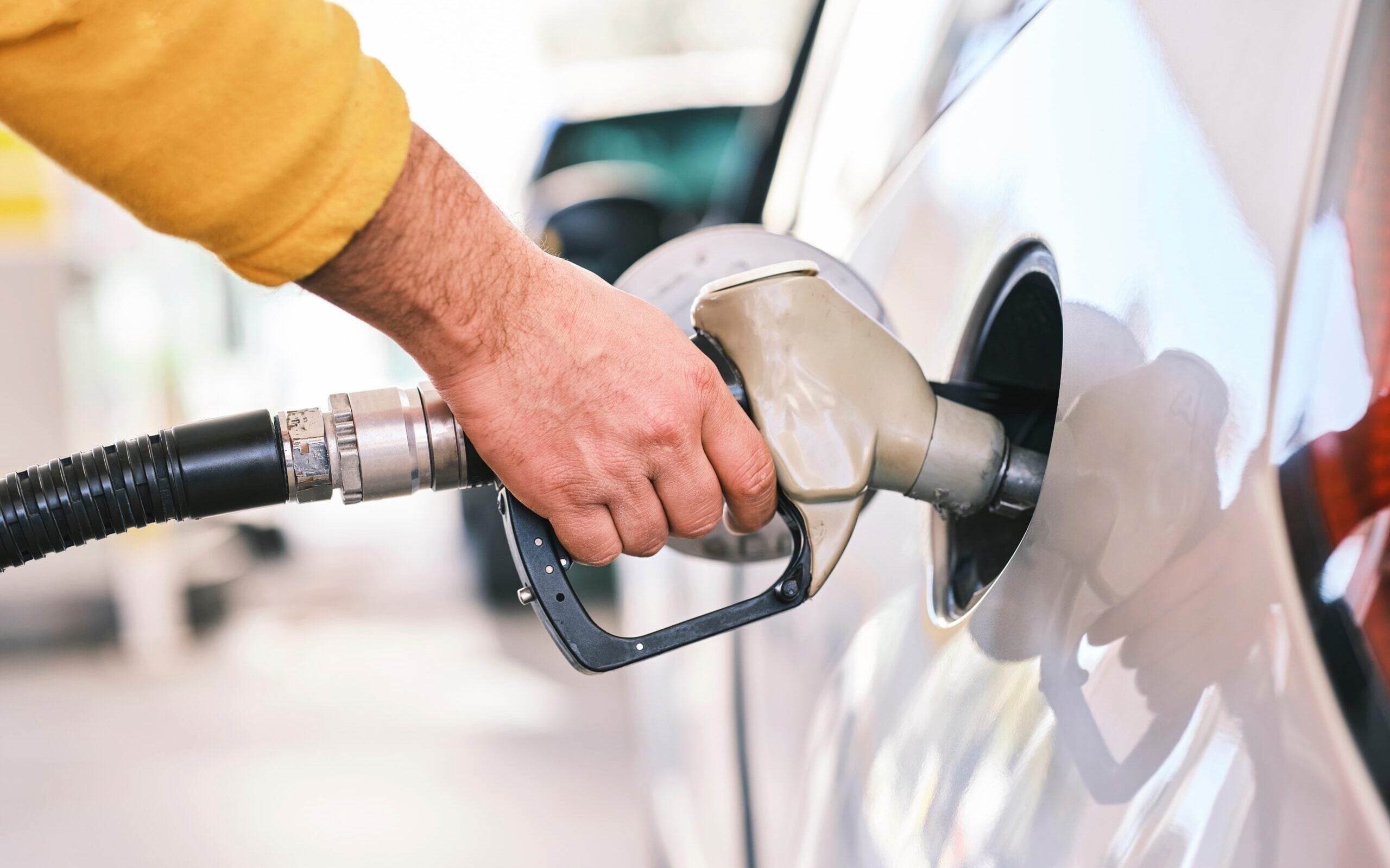 Fuel nozzle inserted into car
