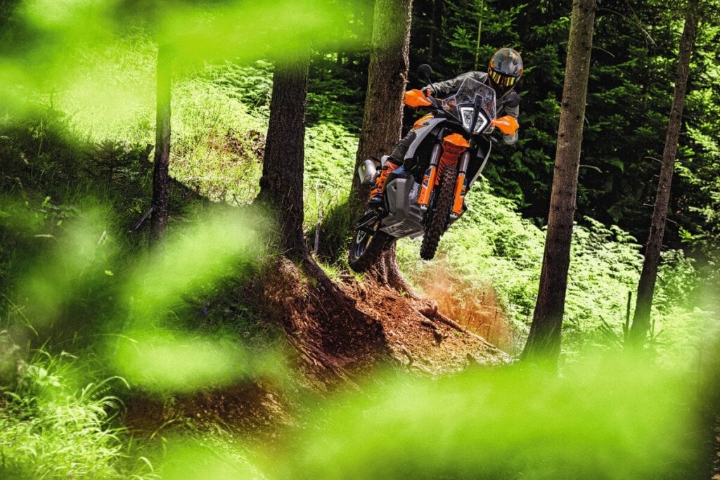 KTM 890 Adventure R jumping off of hill