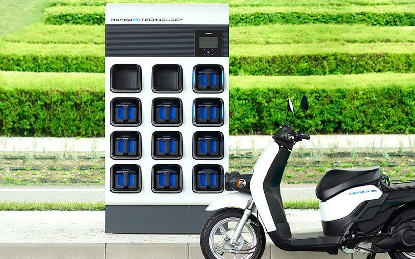 Honda Power Pack Exchanger next to scooter