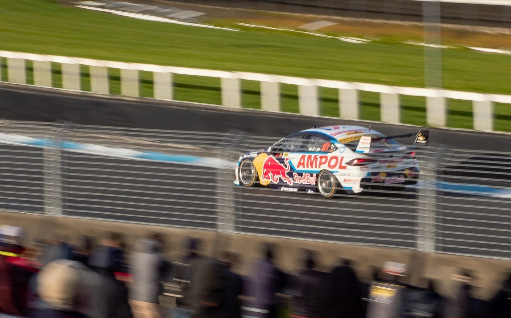 Holden ZB Commodore Supercar racing on track panning view