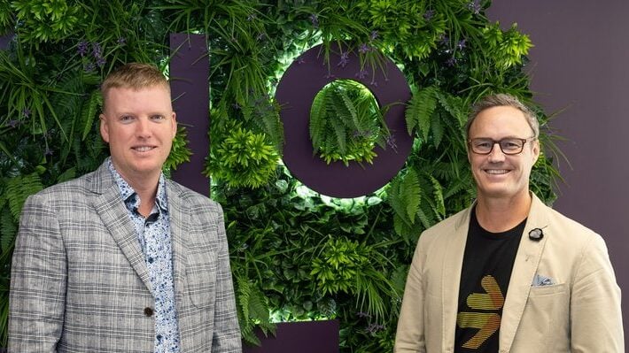 Chris Lamers and Adam Chisnall celebrate MTF Finance's acquisition of the Lending People