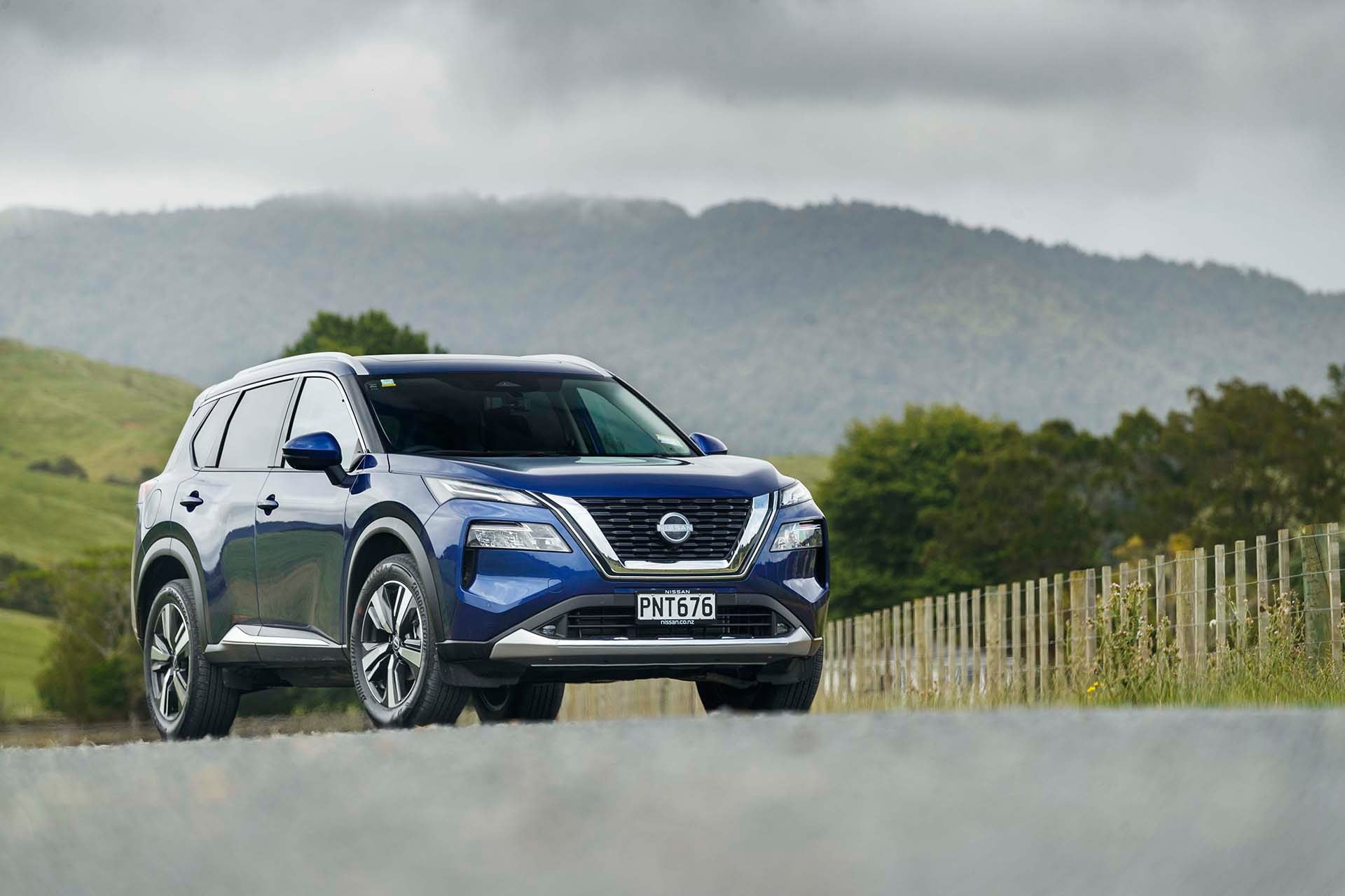 Nissan X-Trail Ti-L with mountains in background