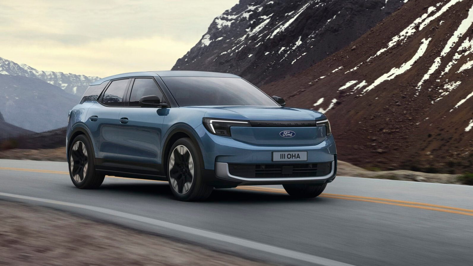 Electric Ford Explorer driving on mountain road