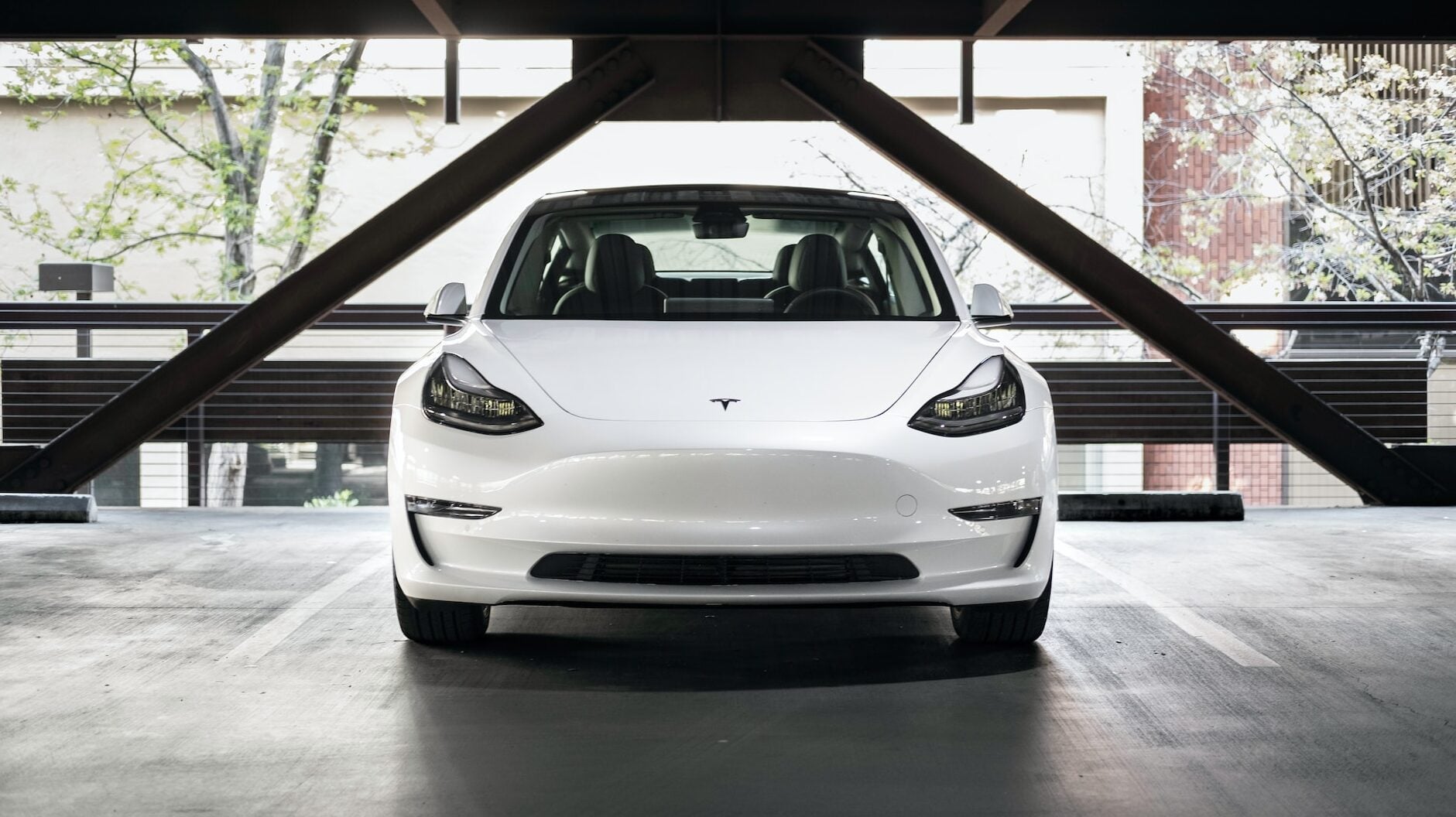 Tesla Model 3 front view in car park