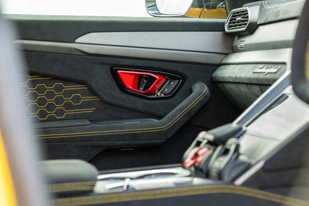 Yellow stitching and red door handles