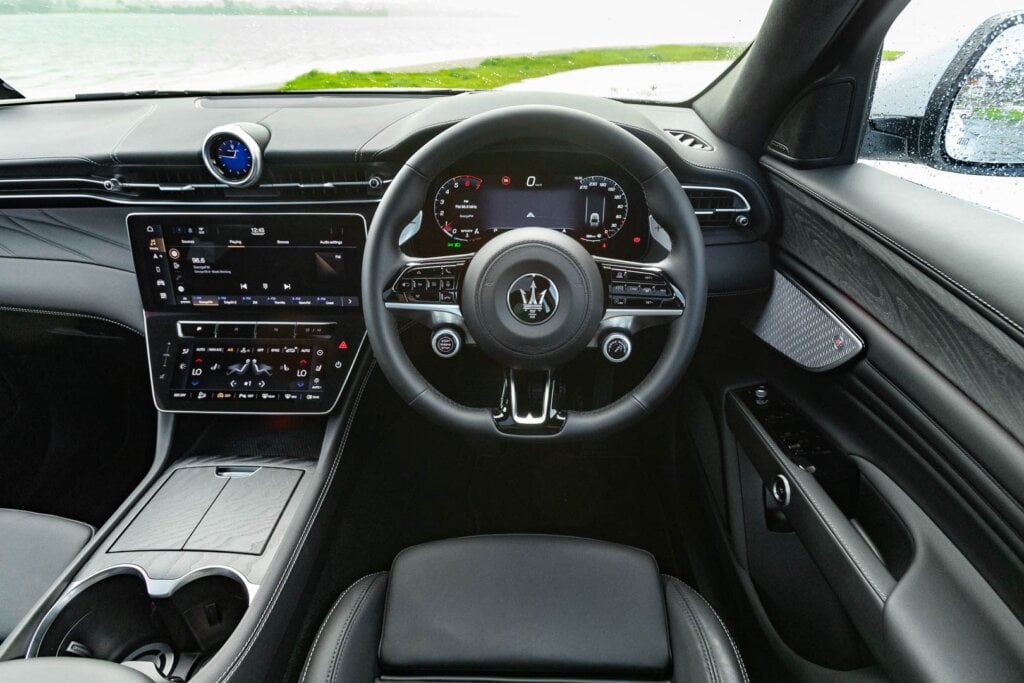 Steering wheel, dash, and door details of the Maserati Grecale Modena