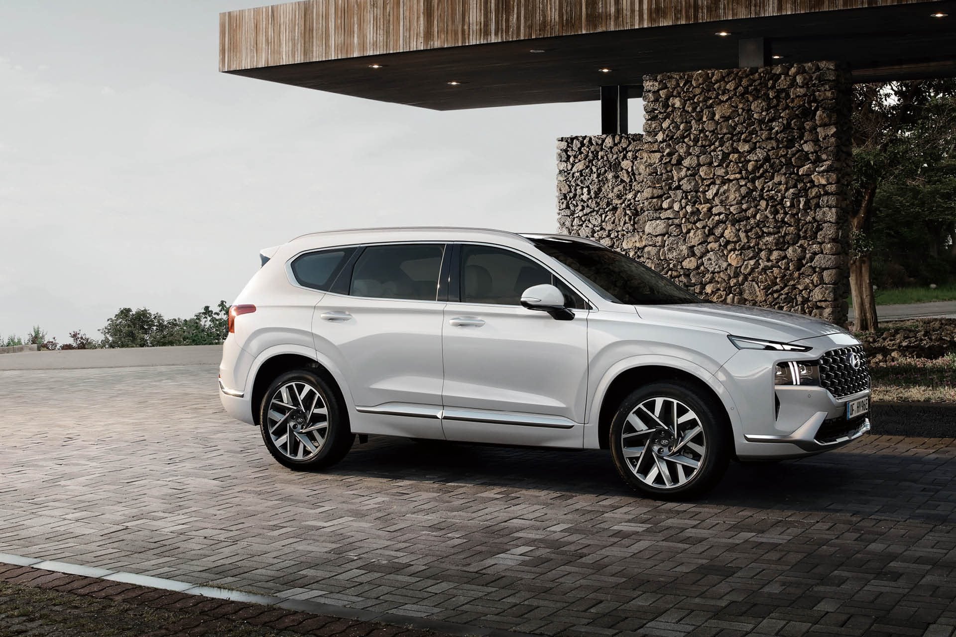 Hyundai Santa Fe Calligraphy parked by house