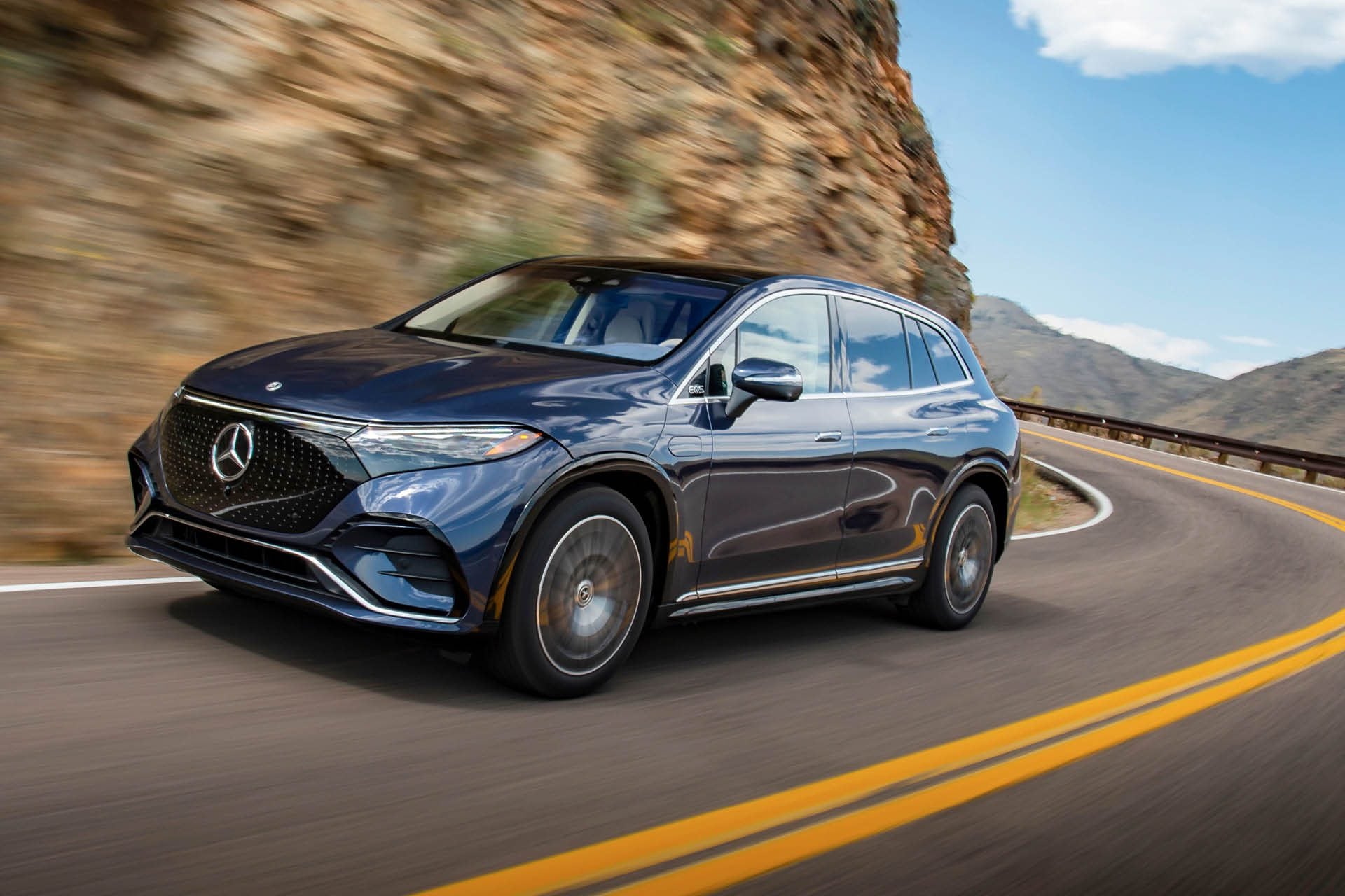 Mercedes-Benz EQS 450 4Matic SUV driving on mountain road