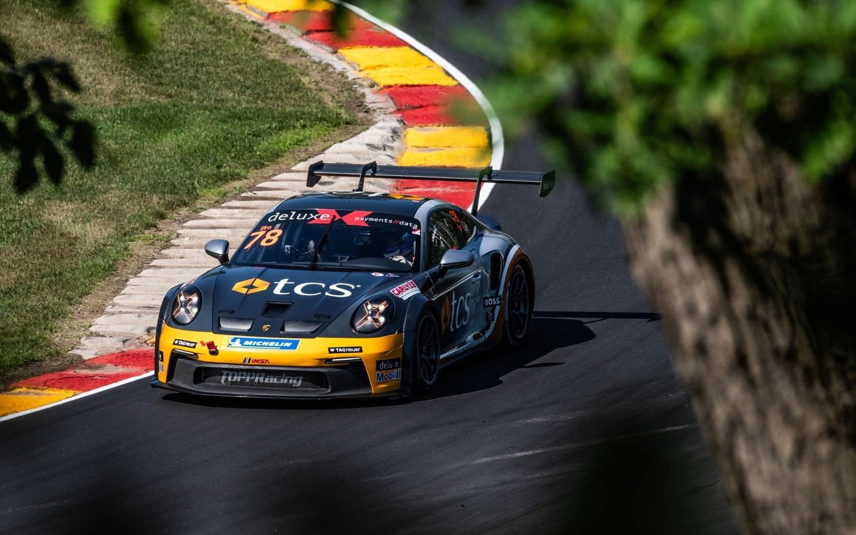 Porsche Carrera Cup car racing around corner in America