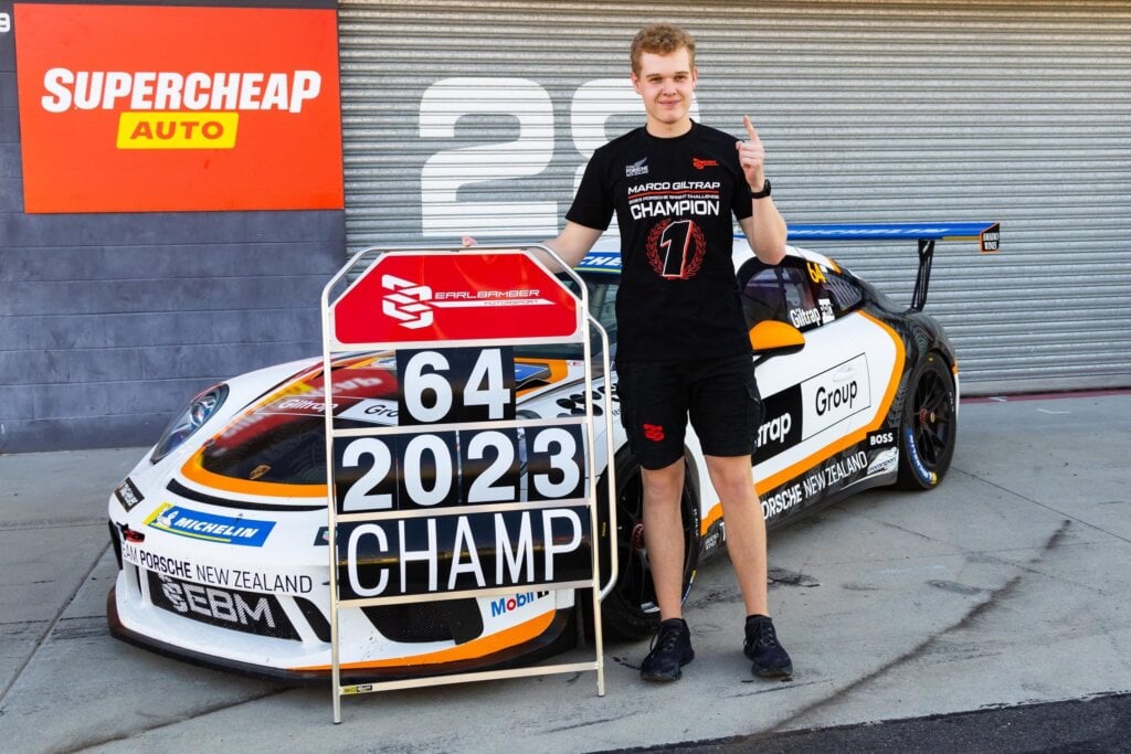 Marco Giltrap standing next to Porsche Carrera Cup car