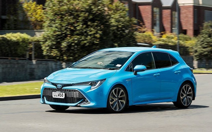 Toyota Corolla Hybrid ZR driving through residential area