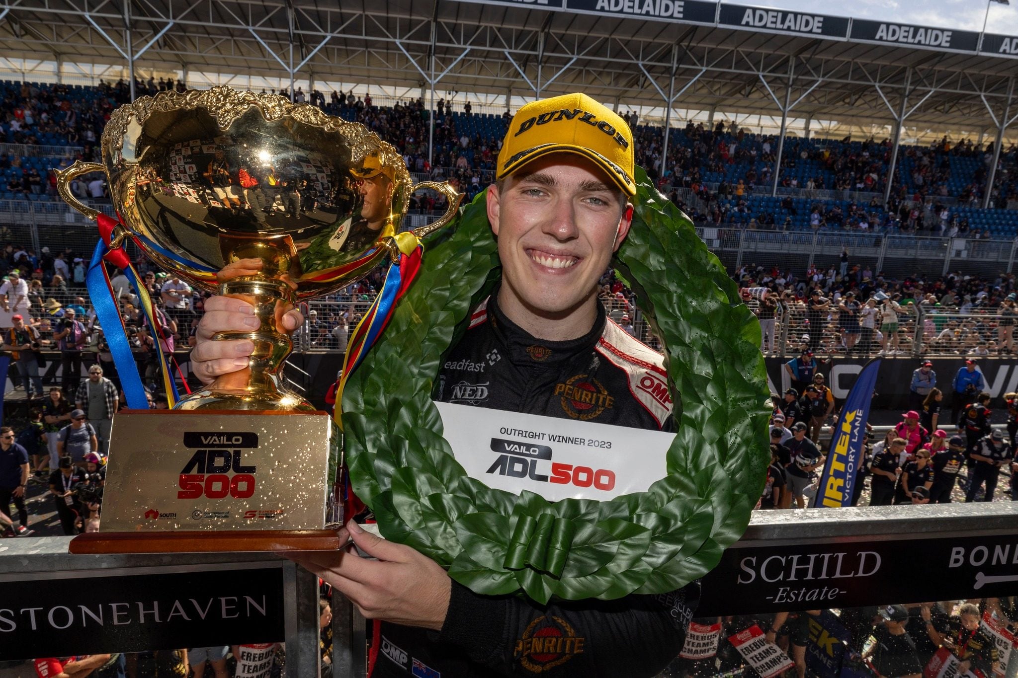 Matt Payne holding up Adelaide 500 race winning trophy