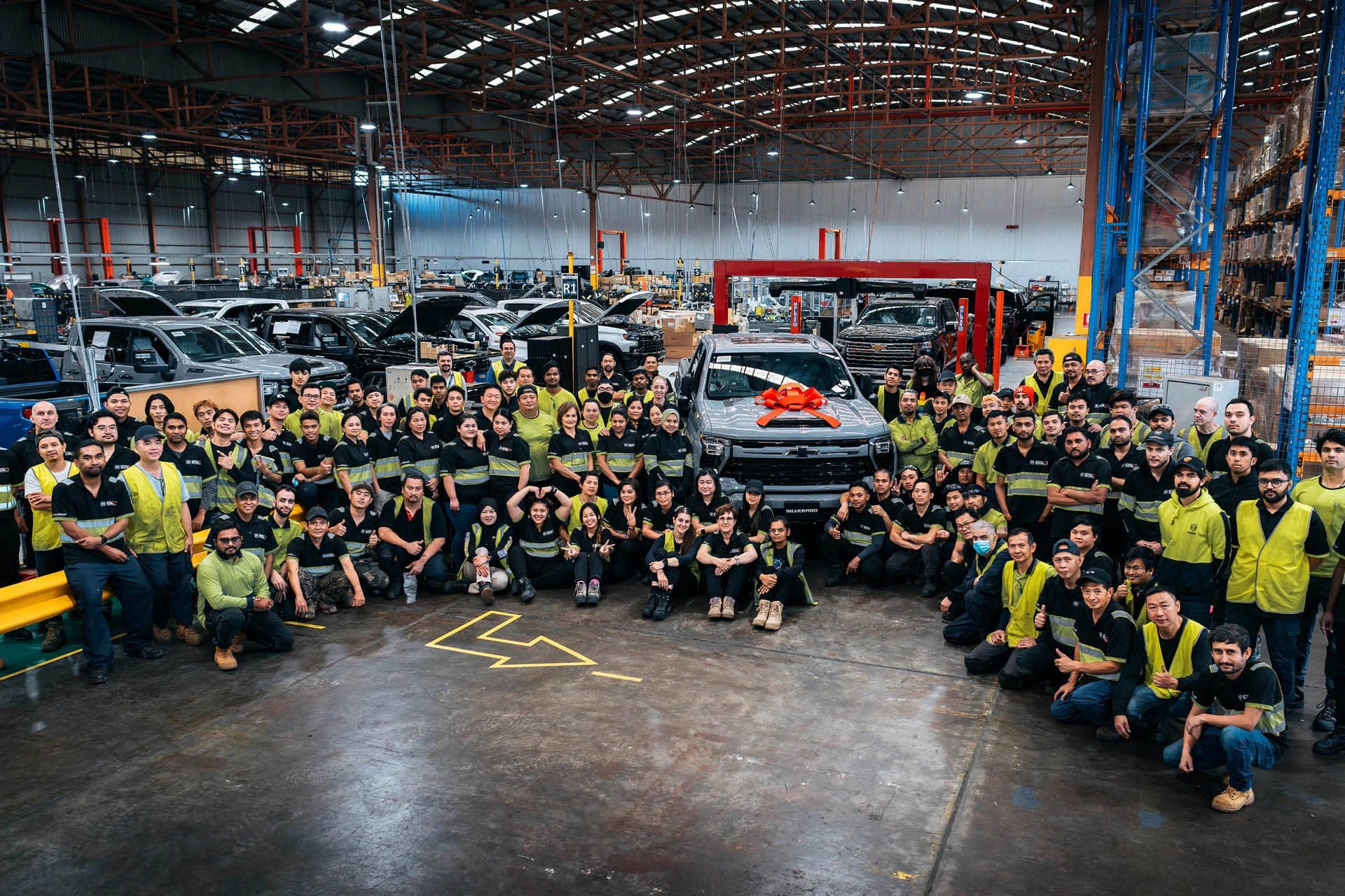 GMSV workers celebrating the production of the 10,000th remanufactured Chevrolet Silverado
