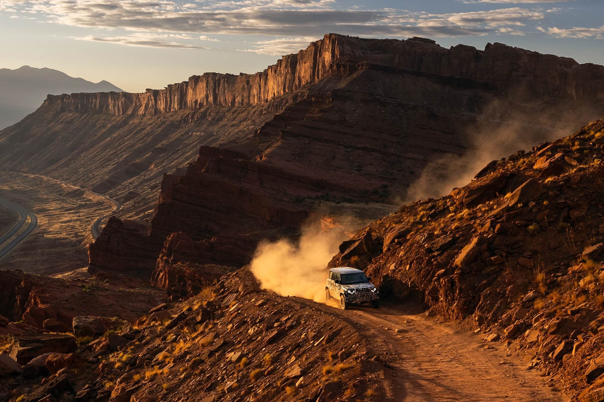 Defender Octa driving on dirt road