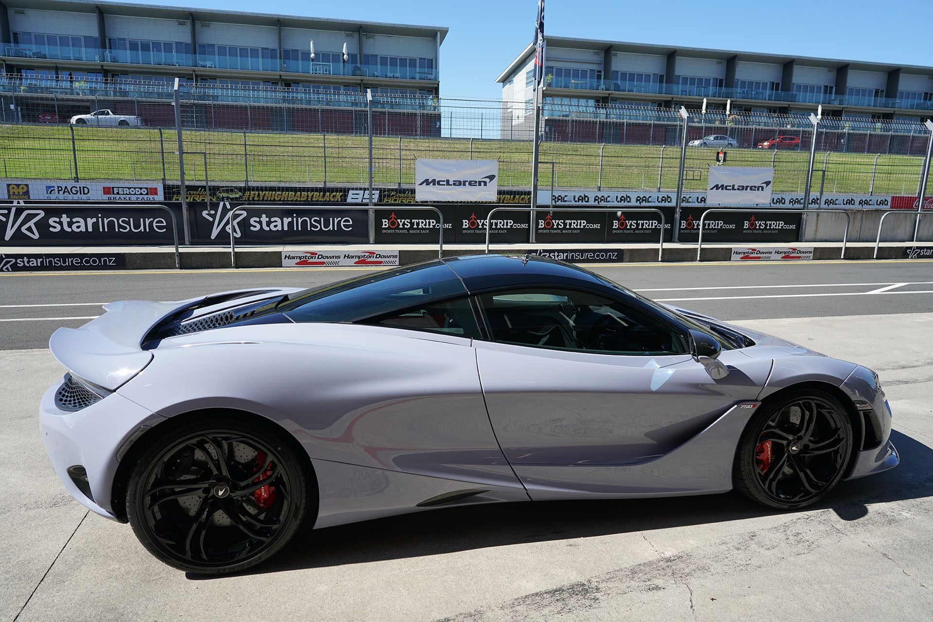 McLaren 750S awaits the day, curvy and grounded.