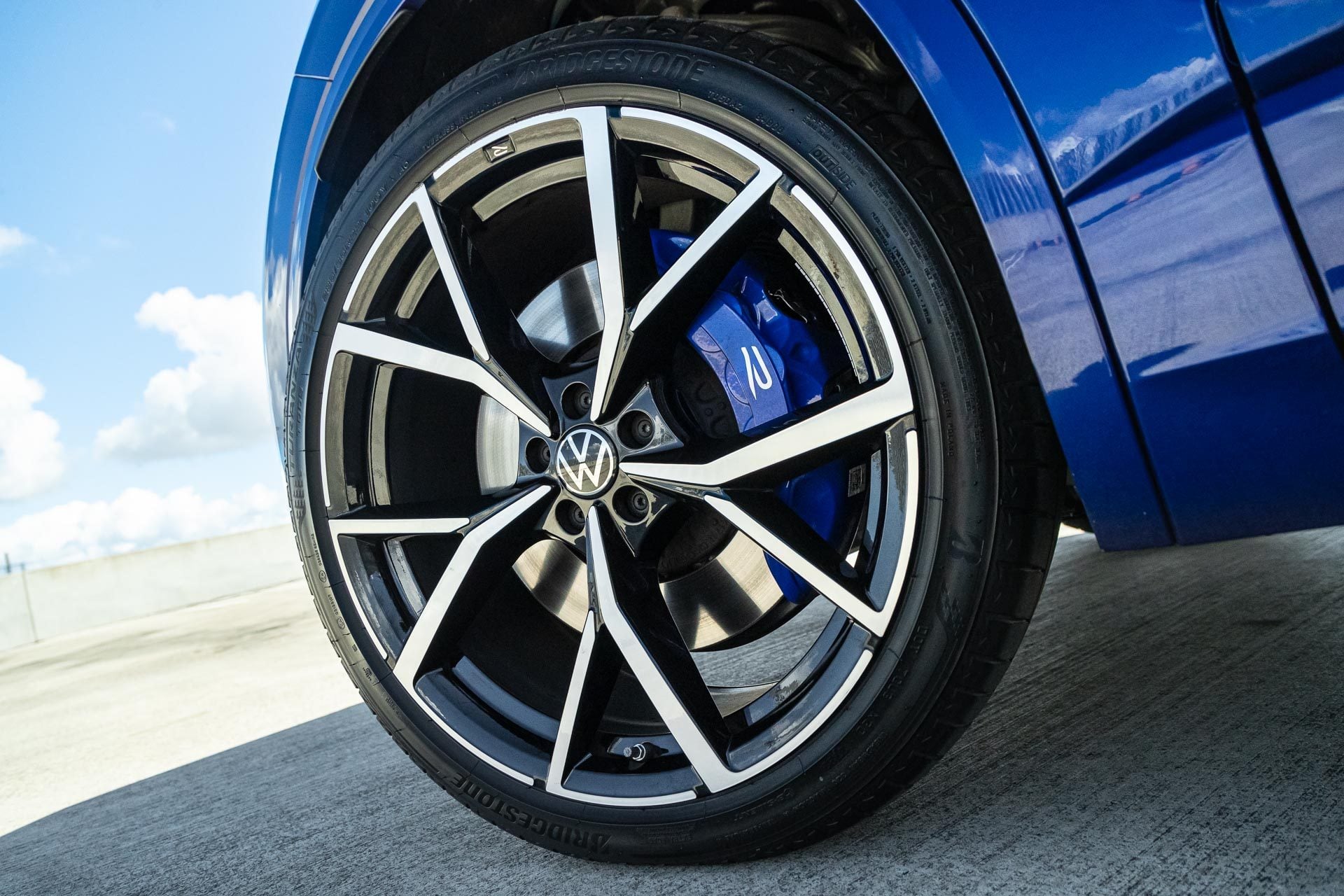 VW wheel under a blue sky