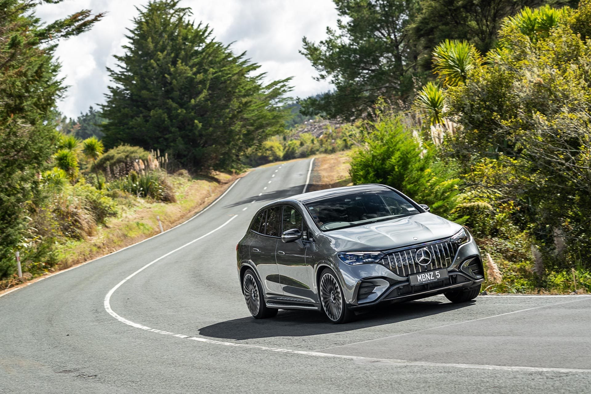 Mercedes-AMG-EQE-53 cornering, showing the front quarter angle of the silver car