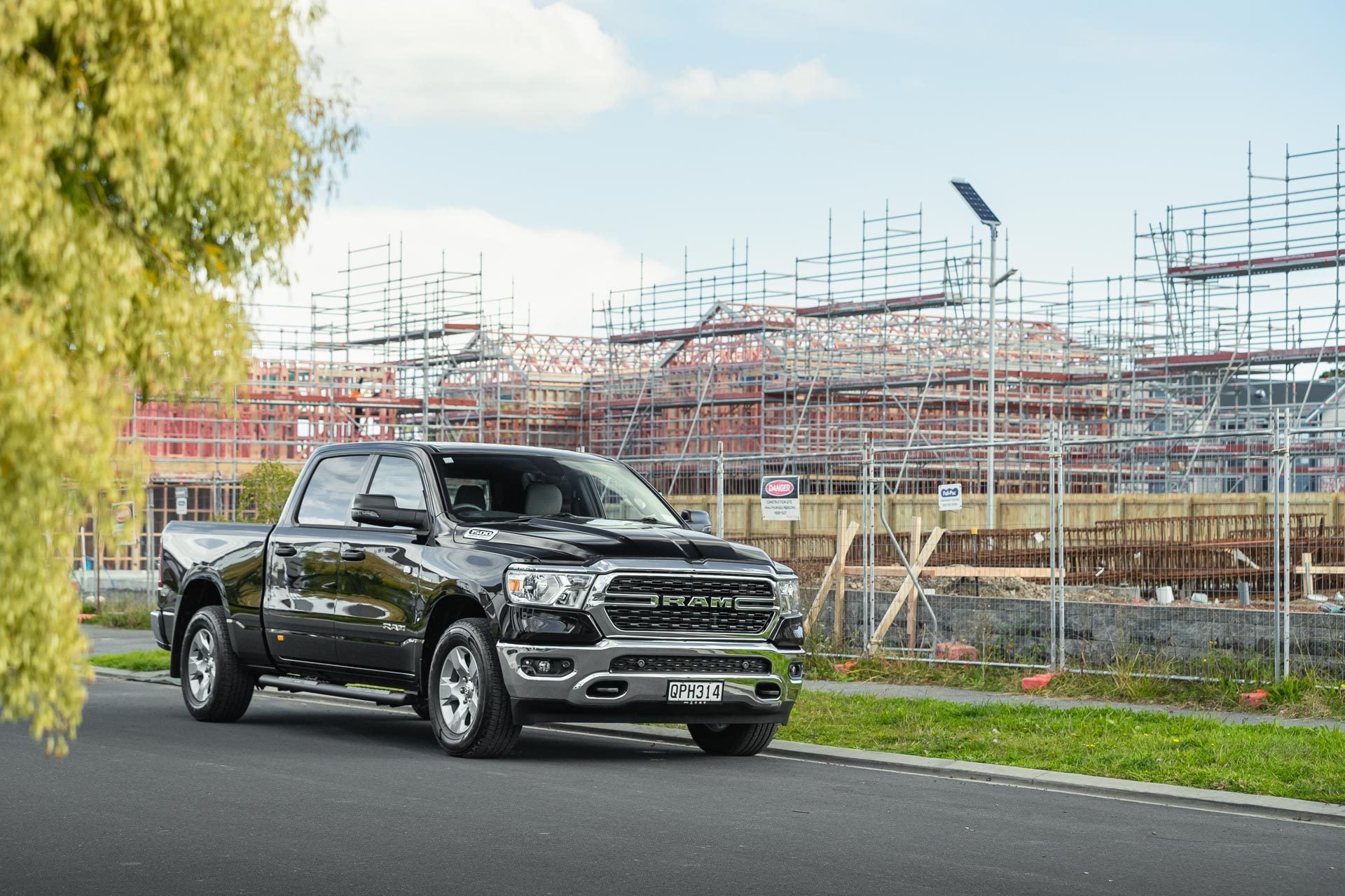 RAM 1500 Big Horn parked in front of a construction site in Auckland