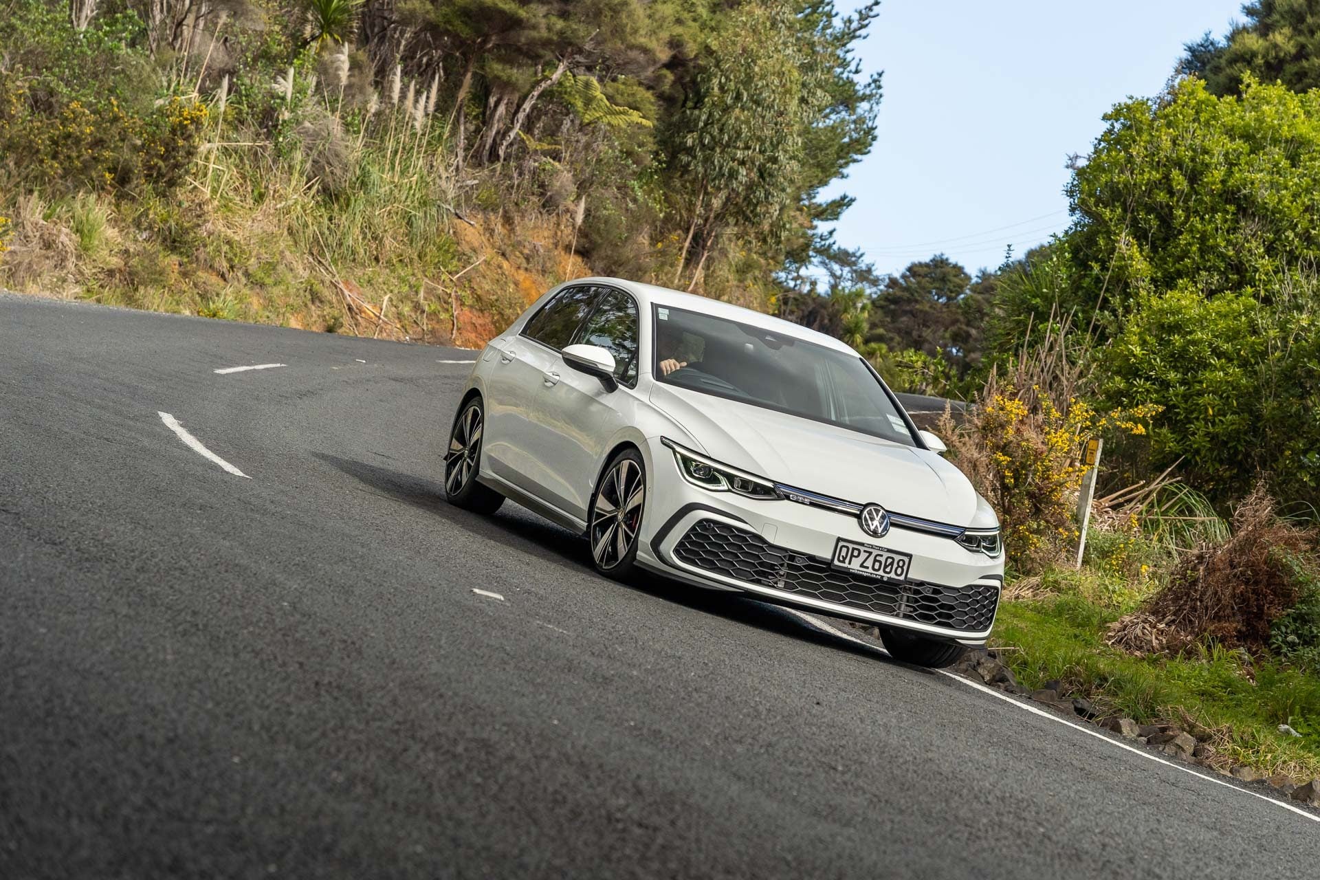VW Golf GTE in white, cornering shot at pace.