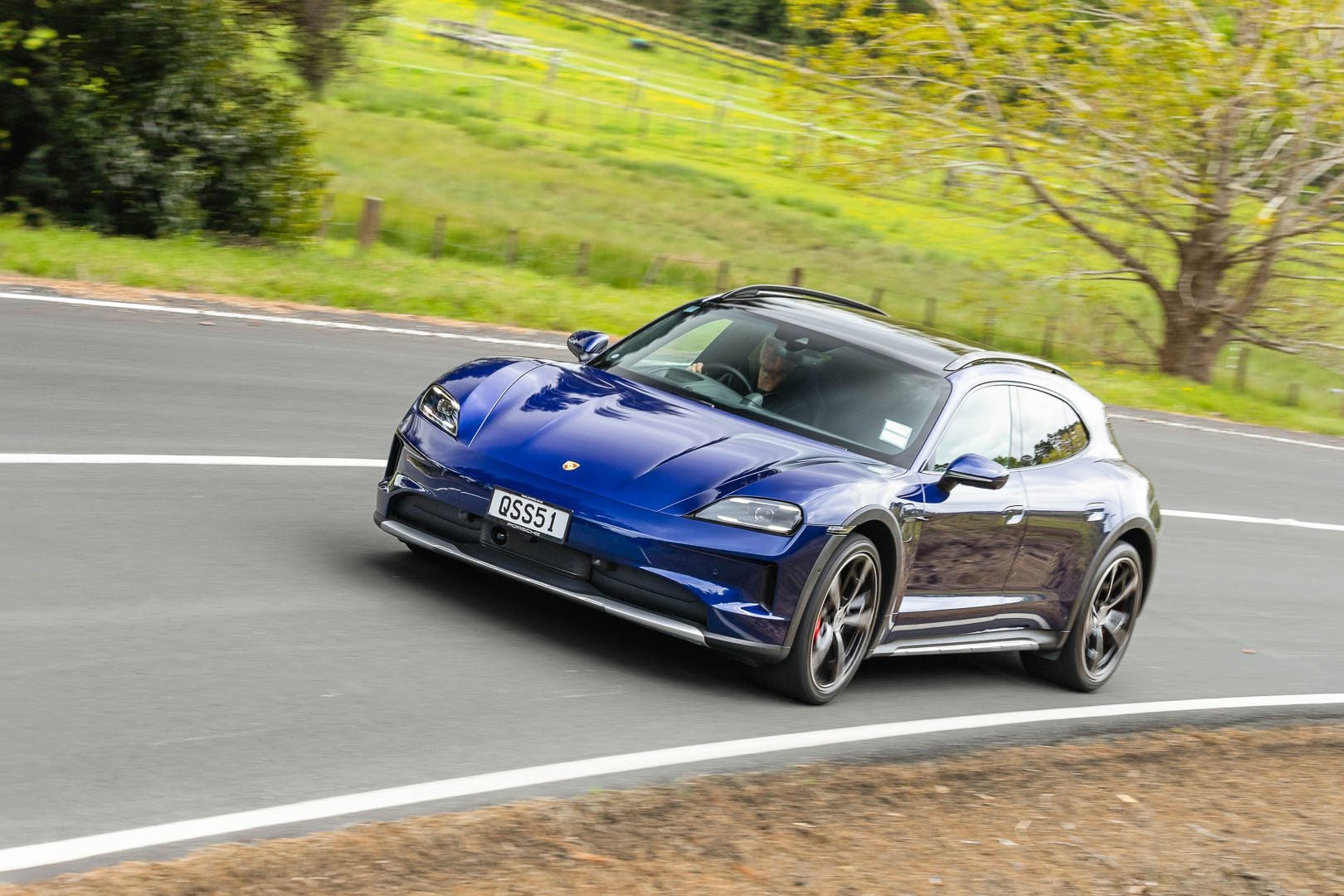 Porsche Taycan 4S Cross Turismo shooting brake, taking a corner at pace