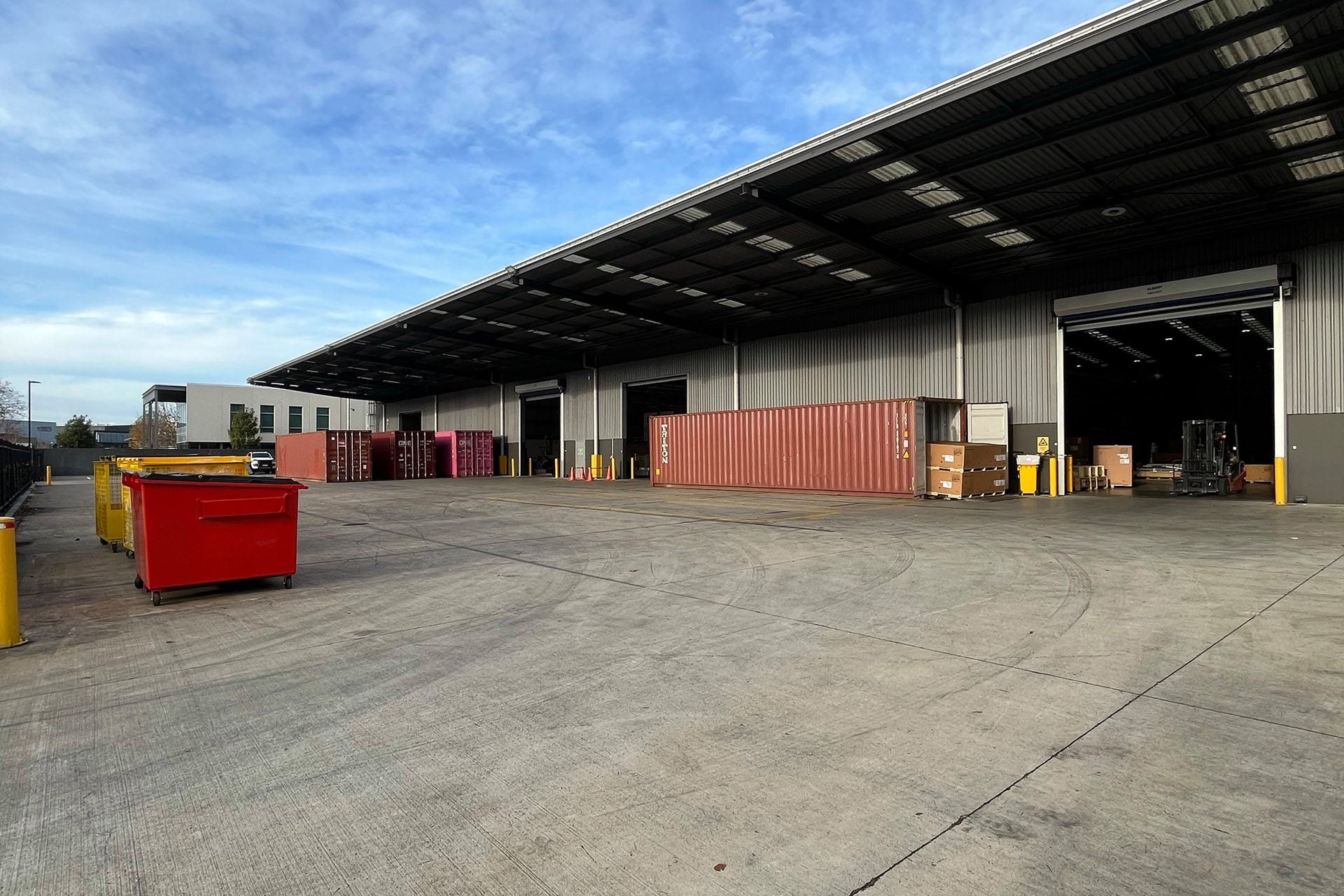 The new facility can manage six containers arriving at once.