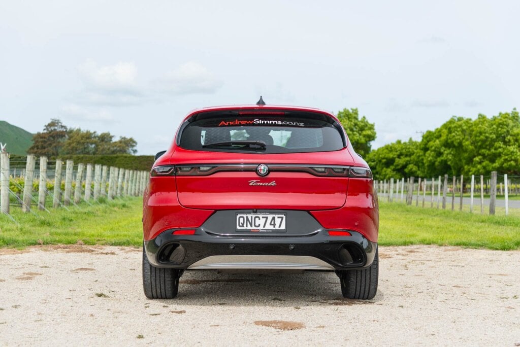 Rear view of the Alfa Romeo Tonale Ti, parked near vineyards