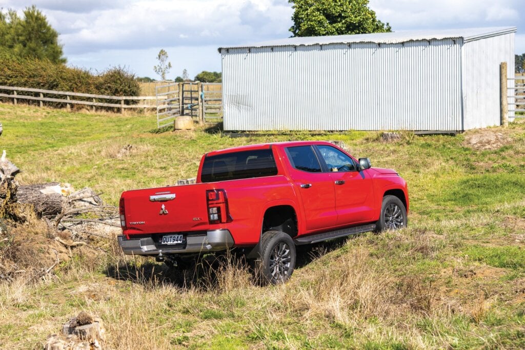 Red Mitsubishi Triton GLX-R parked in a paddock