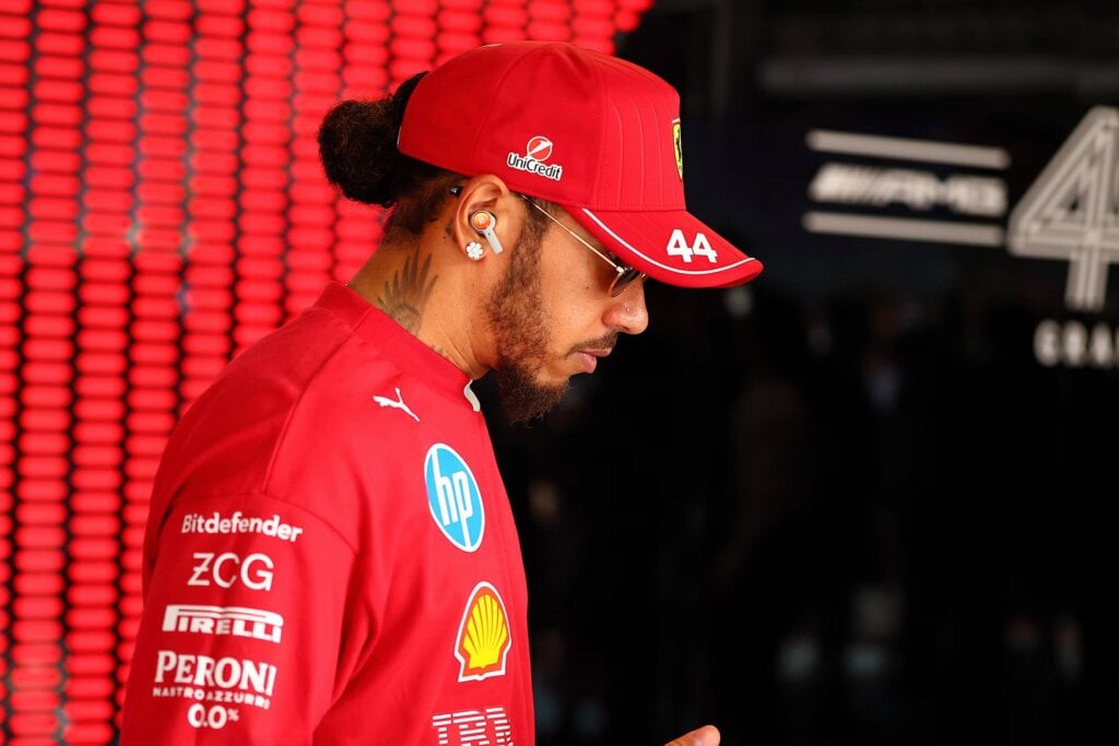Lewis Hamilton looking dejected after another disappointing drive behind the Ferrari wheel.
