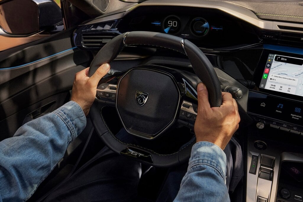 The icockpit device has you look over rather than through the wheel. Cheap HUD, if you will.