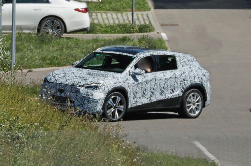 Spy shots show GLA testing on road in camouflage.