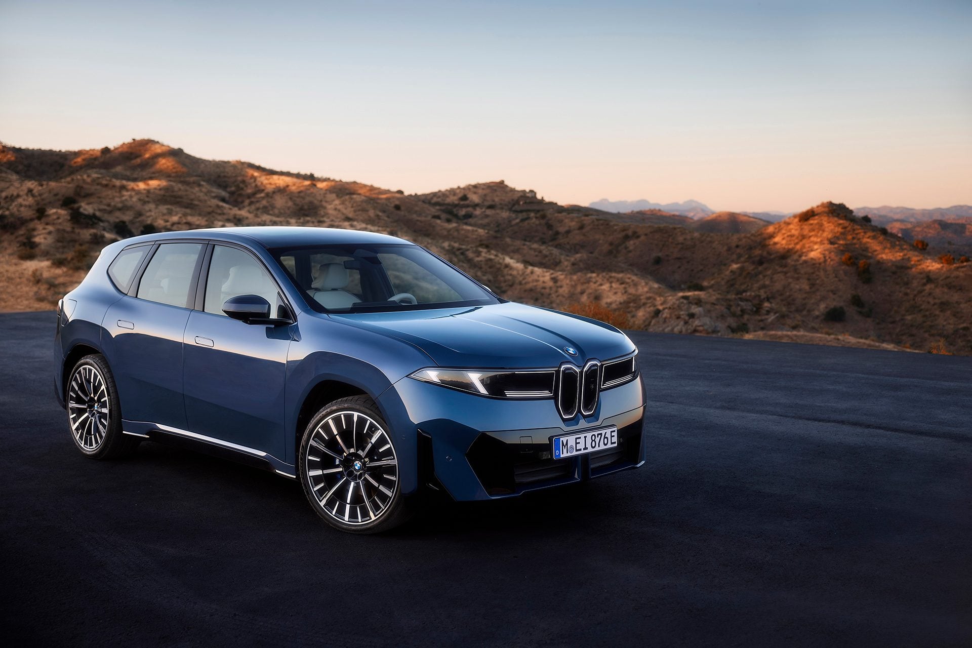 Blue BMW iX3 on black tarmac