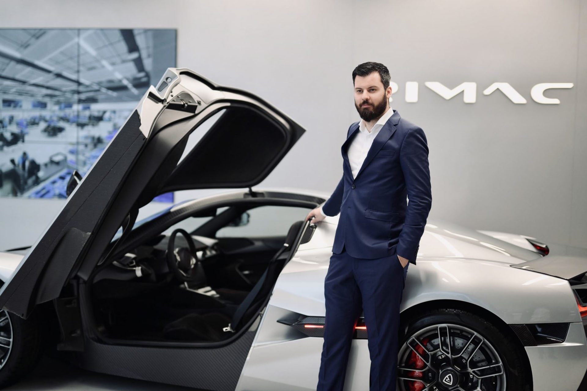 Mate Rimac next to a Rimac