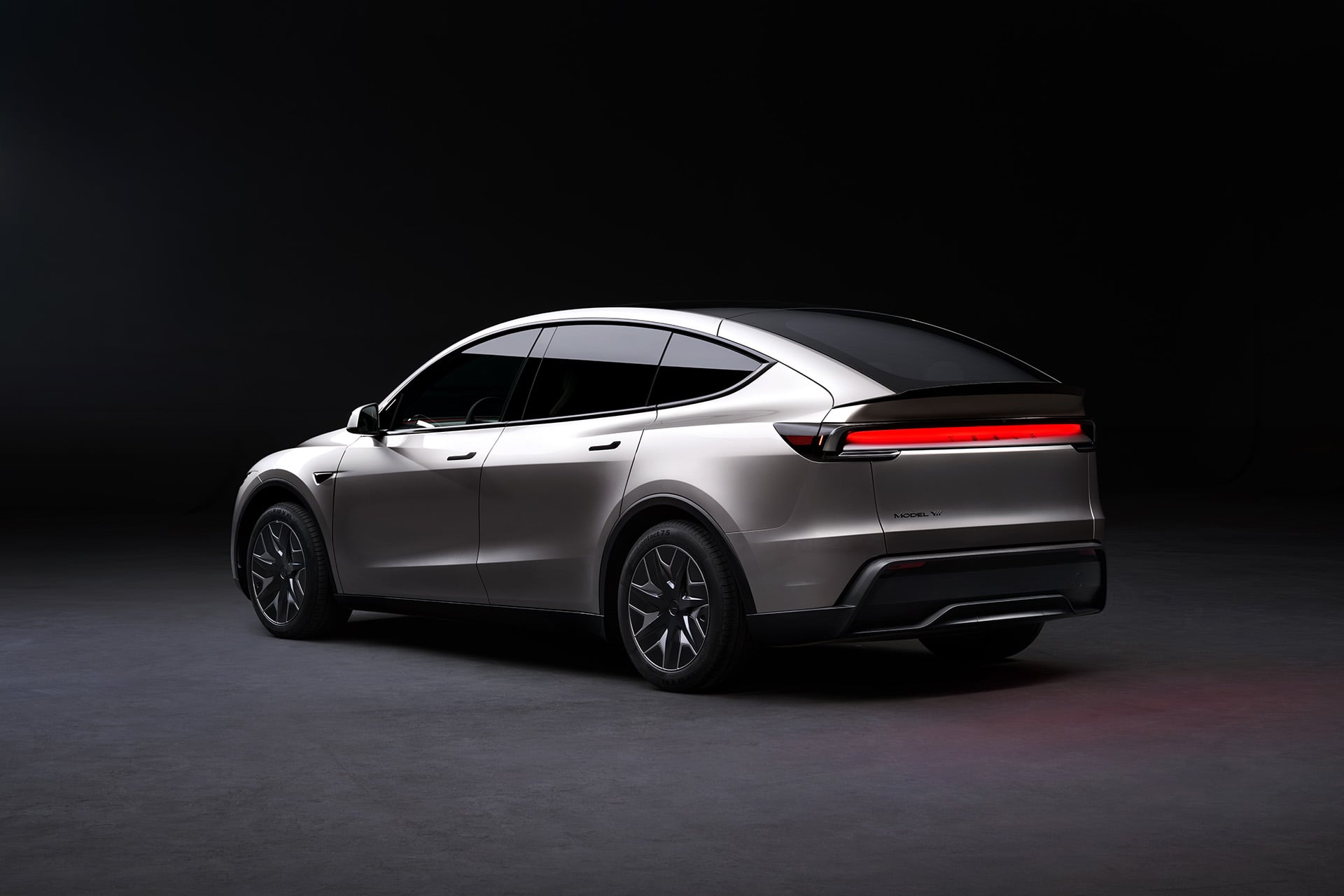Tesla Model Y L in silver from the back