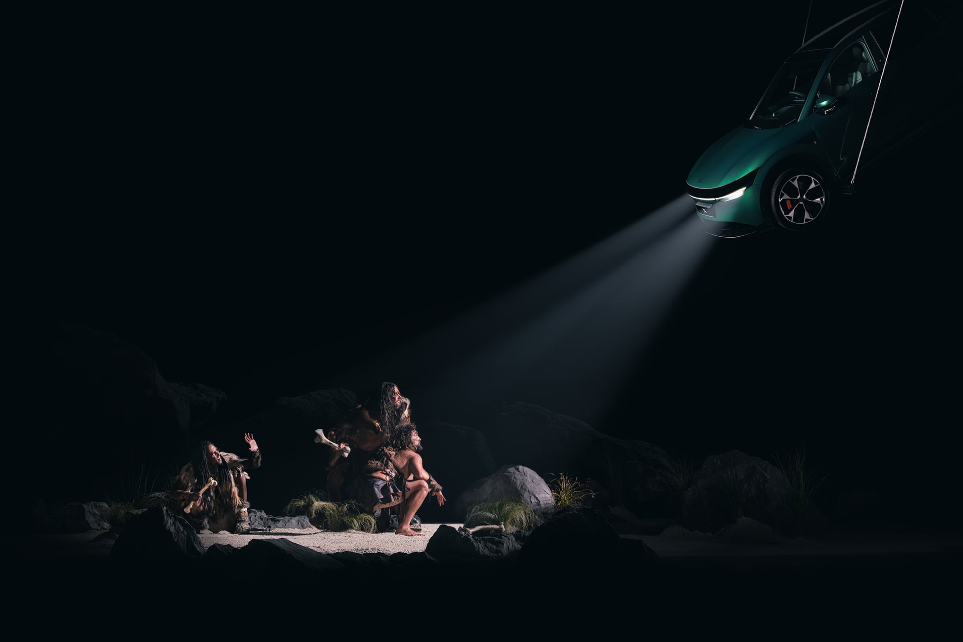 Zeekr shining a light on a cave man