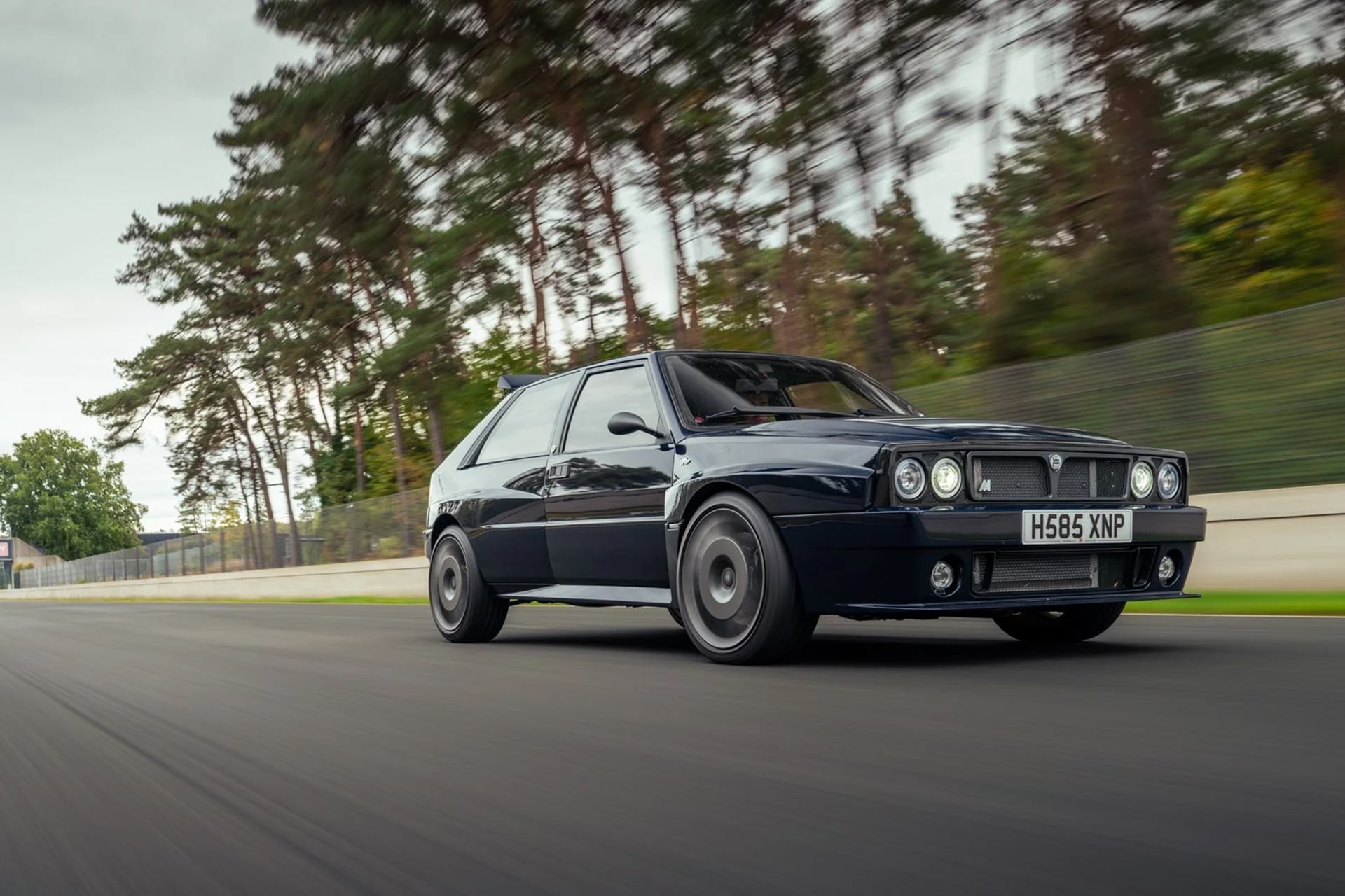 blue Lancia on the track