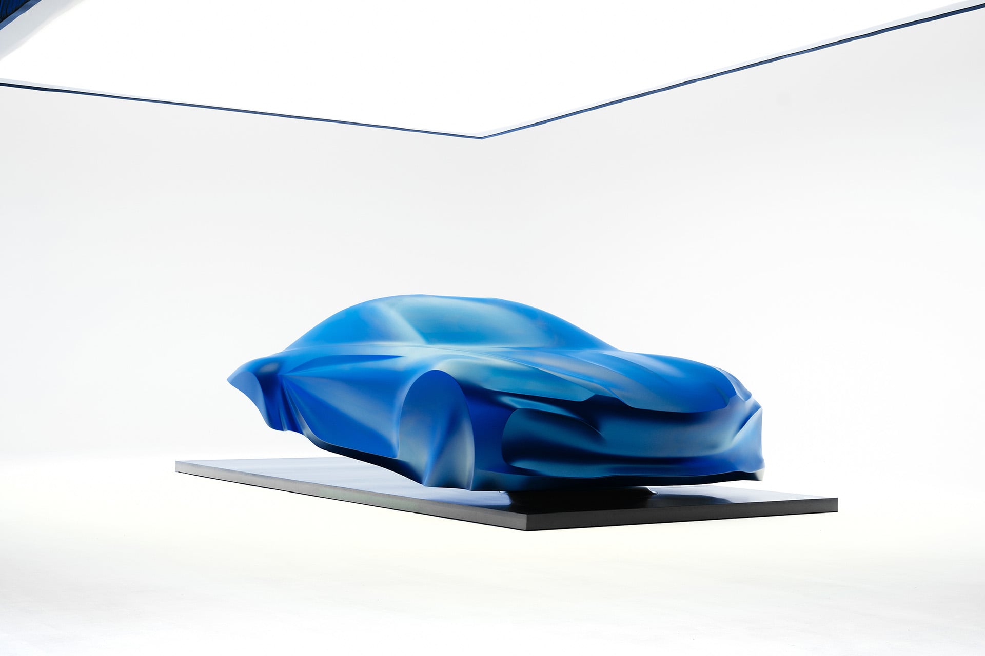 blue sculpture under white lights