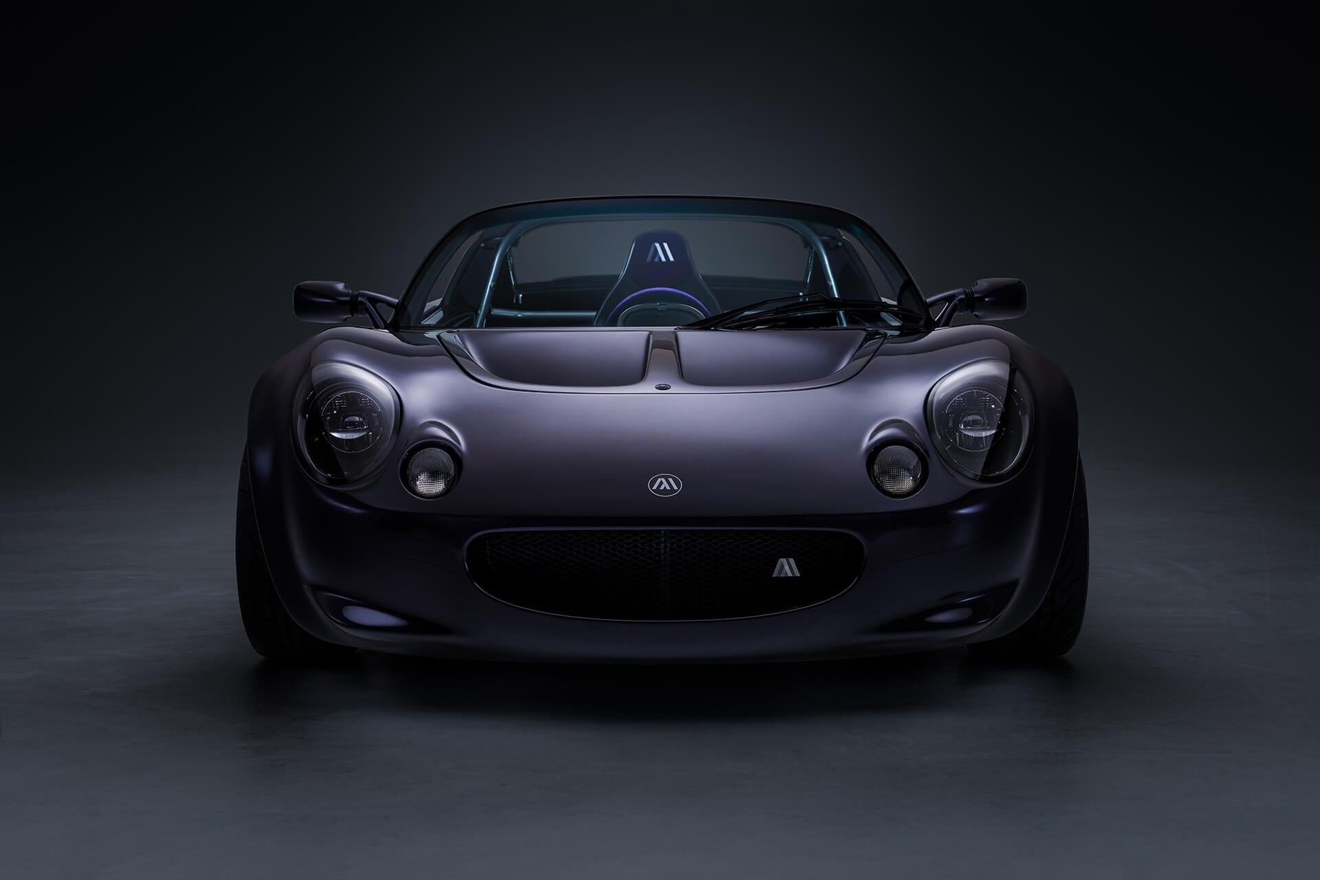 Elise in purple with a central driving position