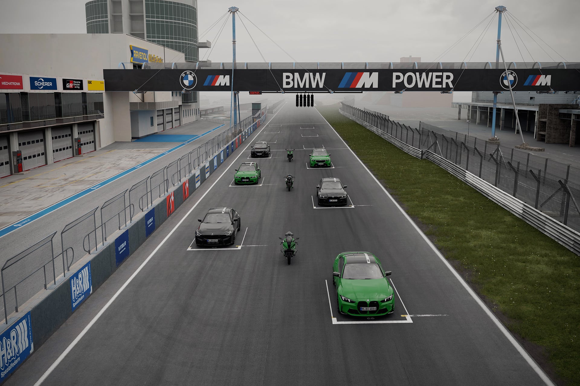 BMW models on a track in the fog
